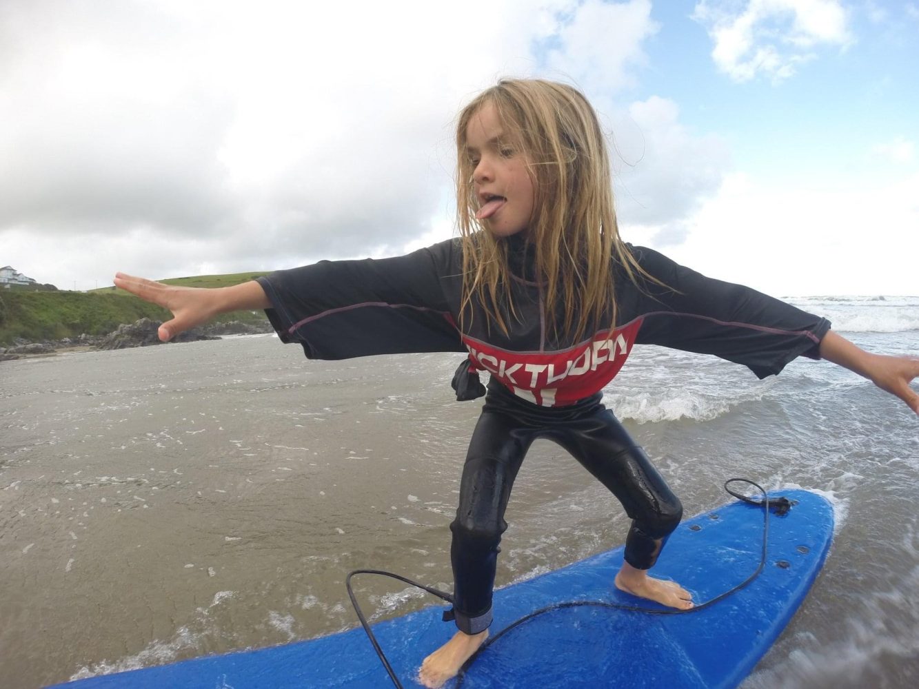 Girl learning to surf