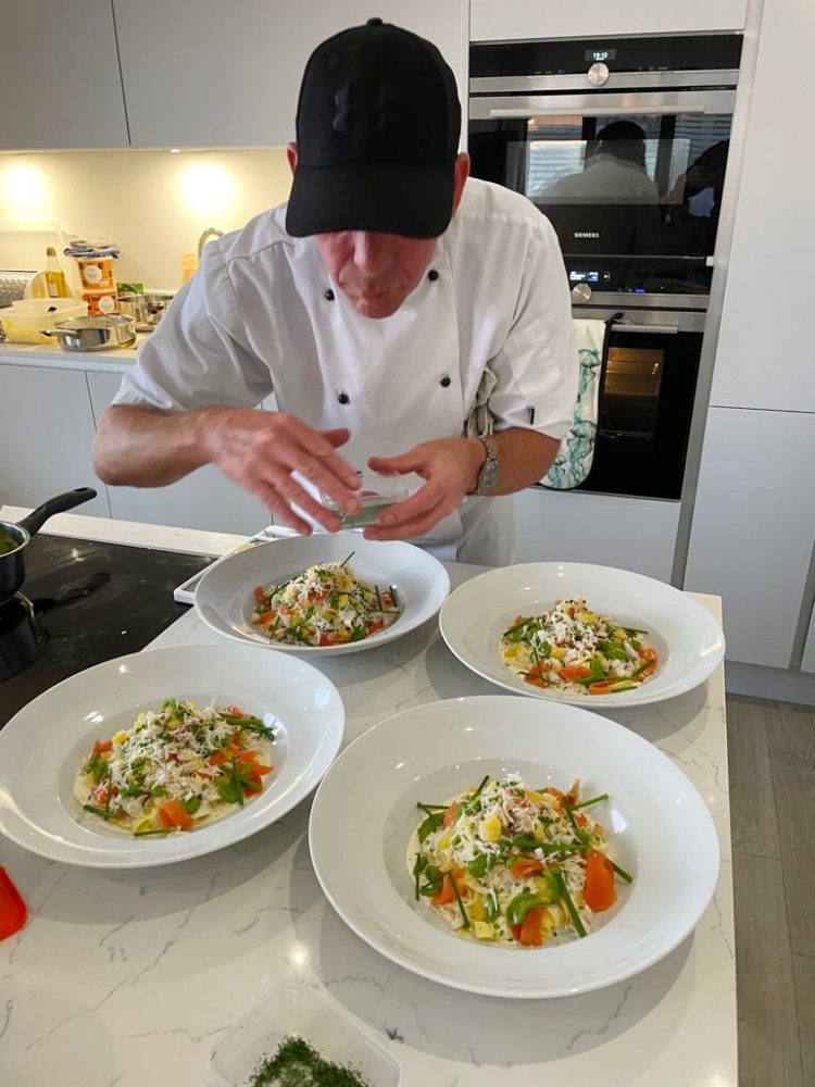 Private chef putting the finishing touches to a private dinner