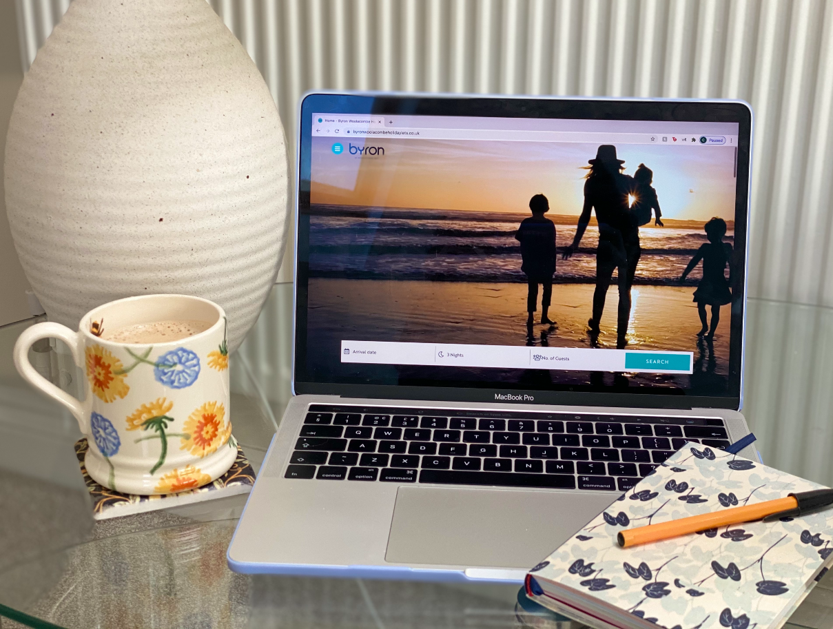 Booking a UK staycation to North Devon on a laptop