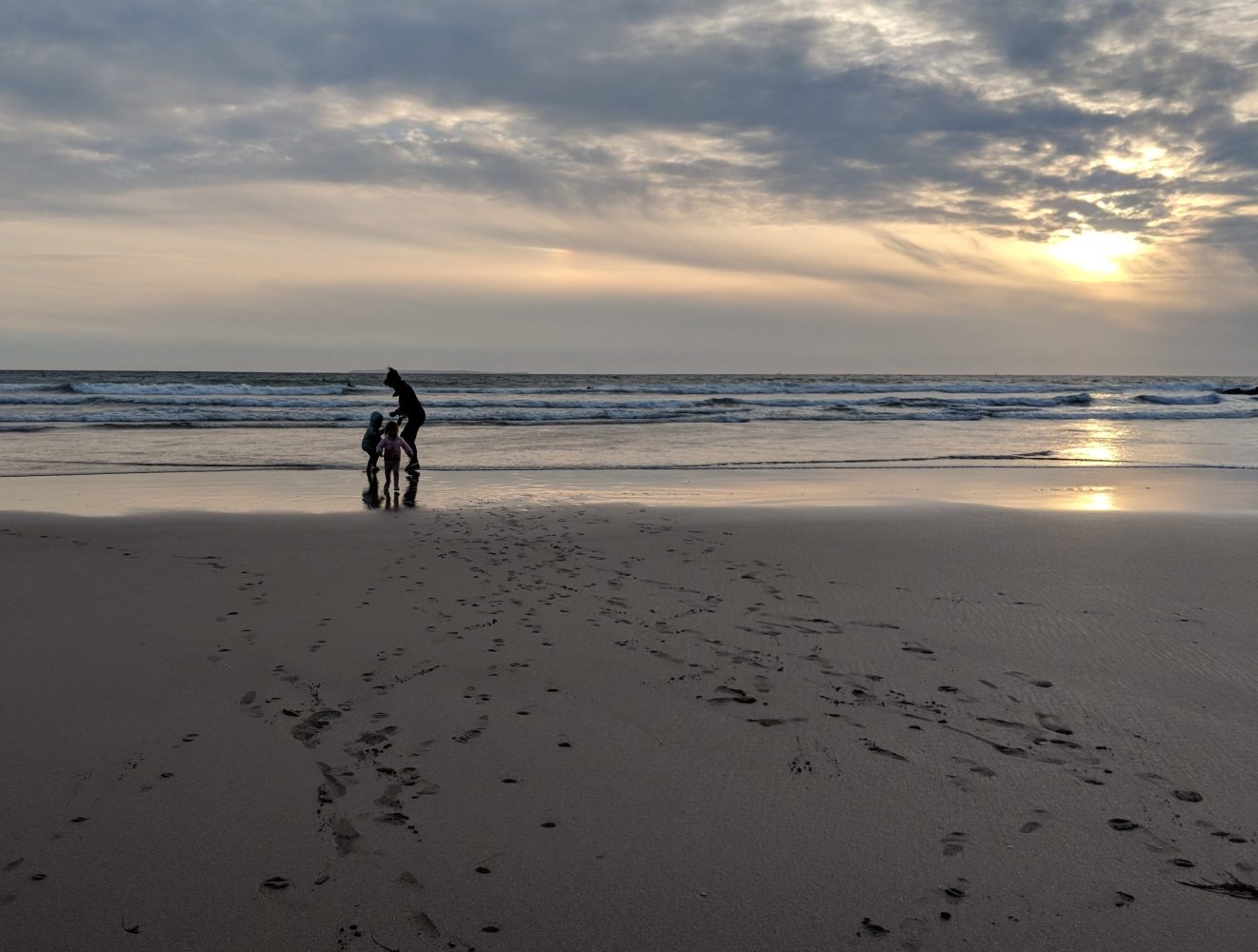 Family padding on a North Devon beach