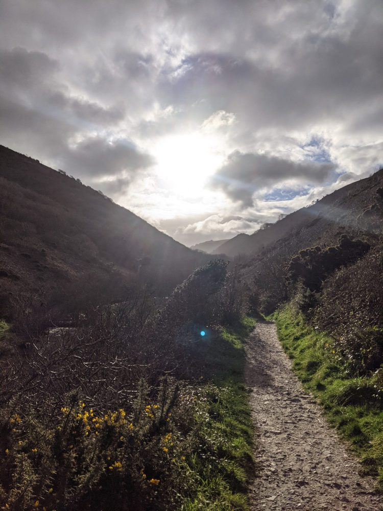 Sun seen through clouds near Heddon's Mouth