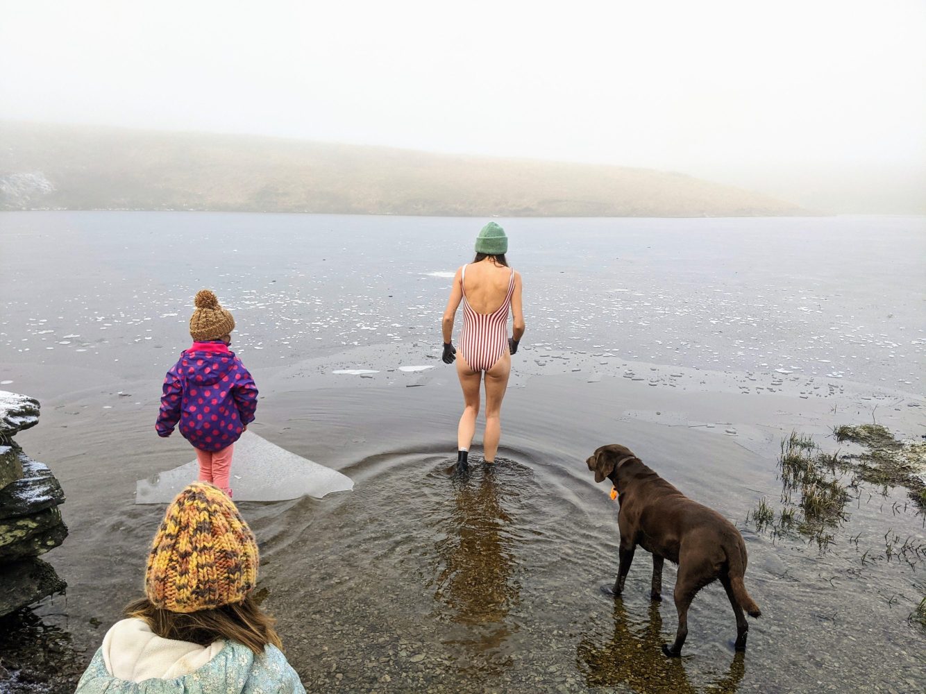 Cold water swimming on a winter family beach day