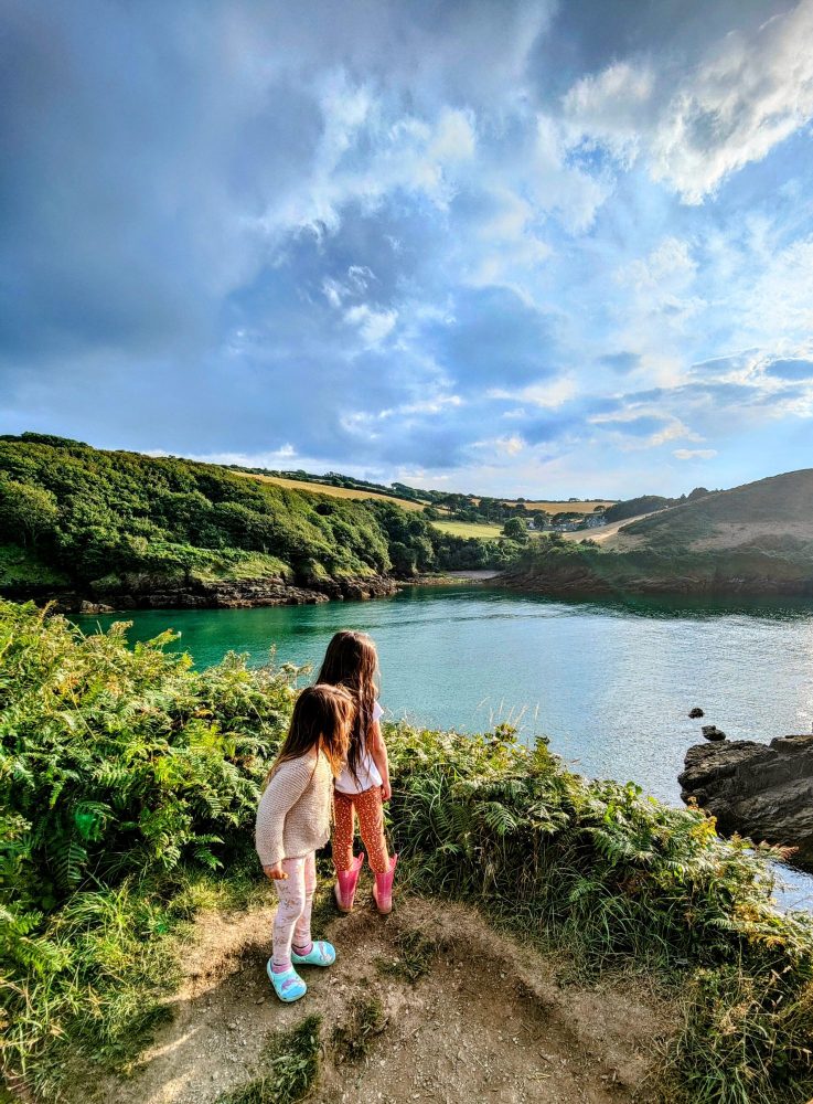Children porpoise spotting out over a bay in North Devon