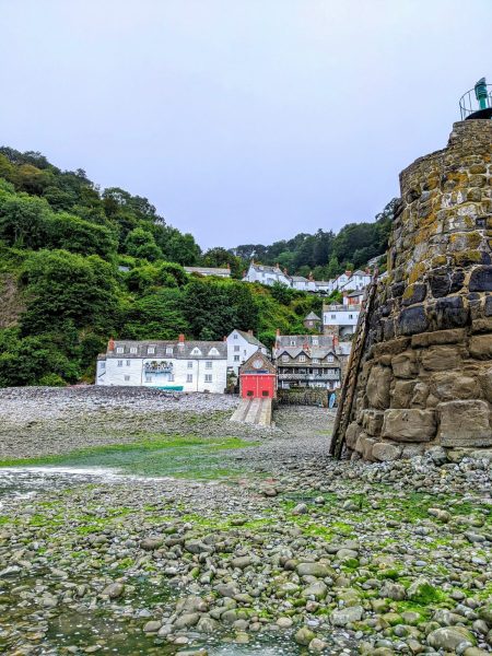 Clovelly coastal village photographed from the shore of the harbour