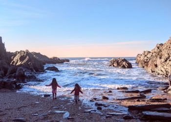 Exploring a rocky beach during a weekend getaway