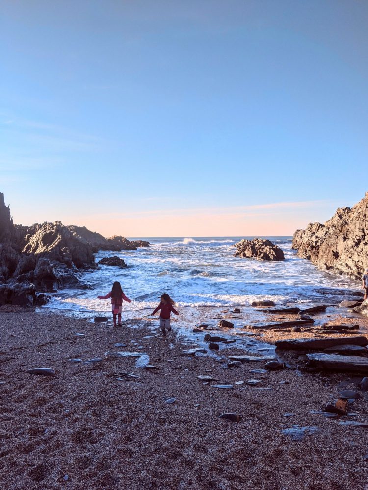 Paddling on a rocky North Devon beach