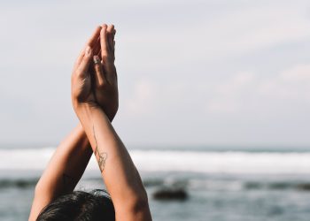 Meditation on a beach during a UK solo getaway