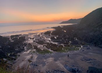 Rocky coast at dawn during a UK beach getaway