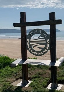 Beach sign saying North Devon World Surfing Reserve